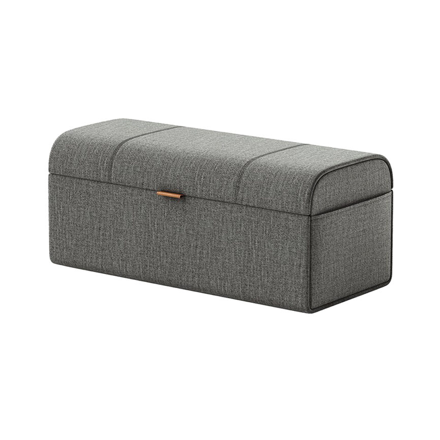 A contemporary small pouf with a storage compartment, upholstered in beige fabric, featuring a front handle for easy access.