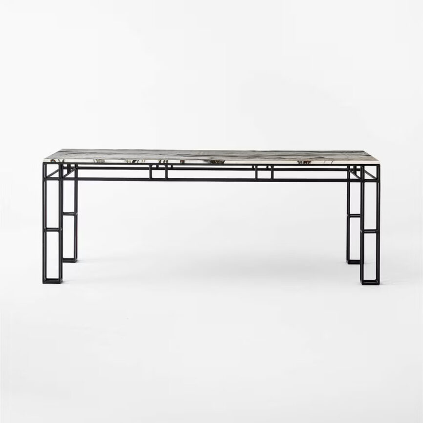 Leccio Dining Table with steel base and marble top, featuring unique chocolate veining. Seats up to 8, made in UAE.
