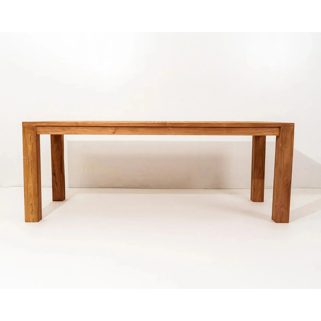 Yugen Outdoor Dining Table made from solid teak wood with brushed finish, designed for modern outdoor living