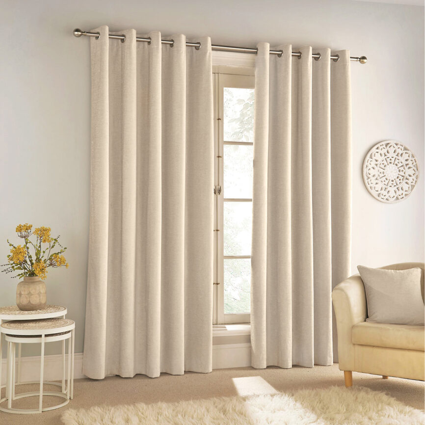 Beige blackout curtain with grommet top, custom-made for privacy and light control in UAE interiors.