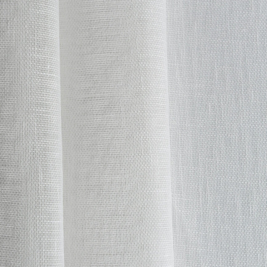 Custom-made elegant sheer curtain in soft fabric, designed to gently filter light while maintaining privacy - ideal for living spaces and open interiors.