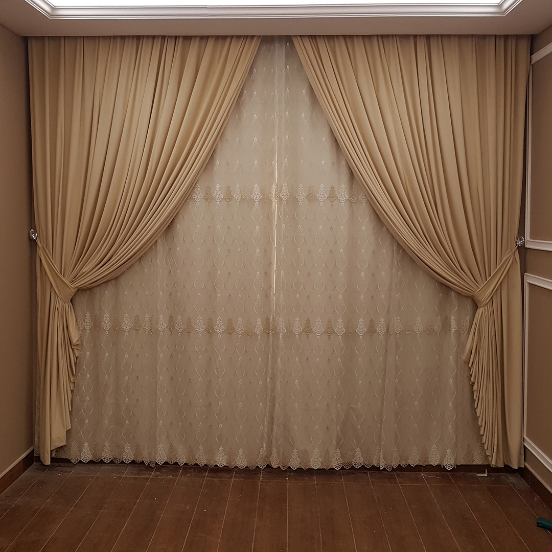 Elegant triple-layer curtain with blackout, sheer, and fabric panels, customizable in size and color, featuring smooth operation and luxury detailing.