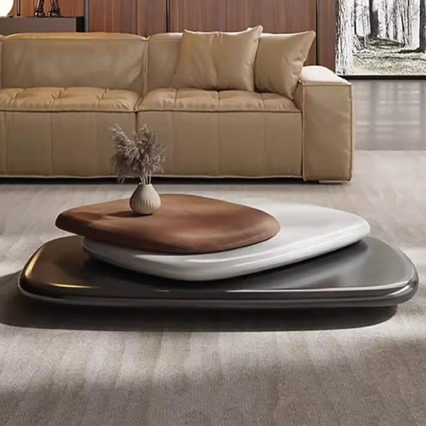 Luxury three-tier rotating coffee table with walnut veneer top and matte black steel base, featuring flexible nested design and precision detailing.