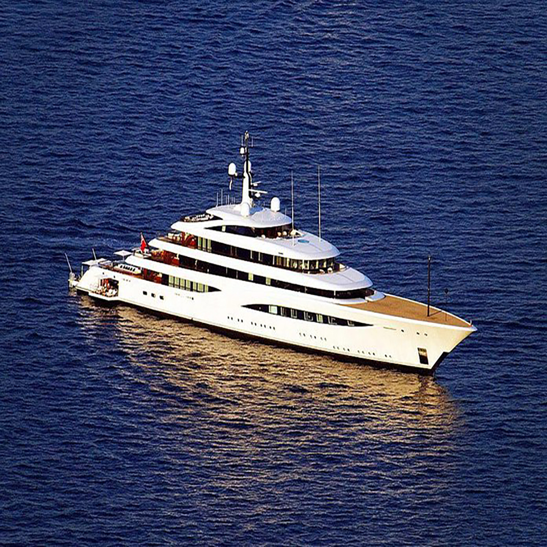 Luxury bespoke bed linen set with white cotton fabric and blue embroidery, tailored for yachts and marine cabins in the UAE