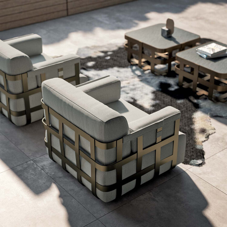 Luxury armchair with customizable chrome, brass, or gold mirror-finish stainless steel frame and upholstered seat - ideal for yachts or upscale interiors in the UAE.