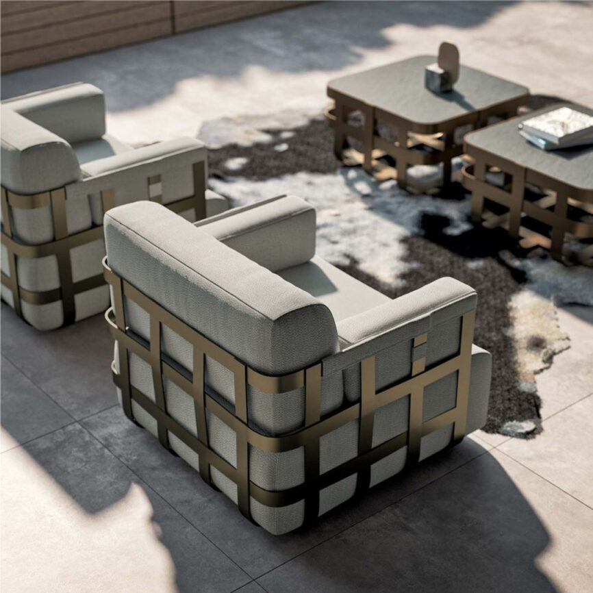 Luxury armchair with customizable chrome, brass, or gold mirror-finish stainless steel frame and upholstered seat - ideal for yachts or upscale interiors in the UAE.