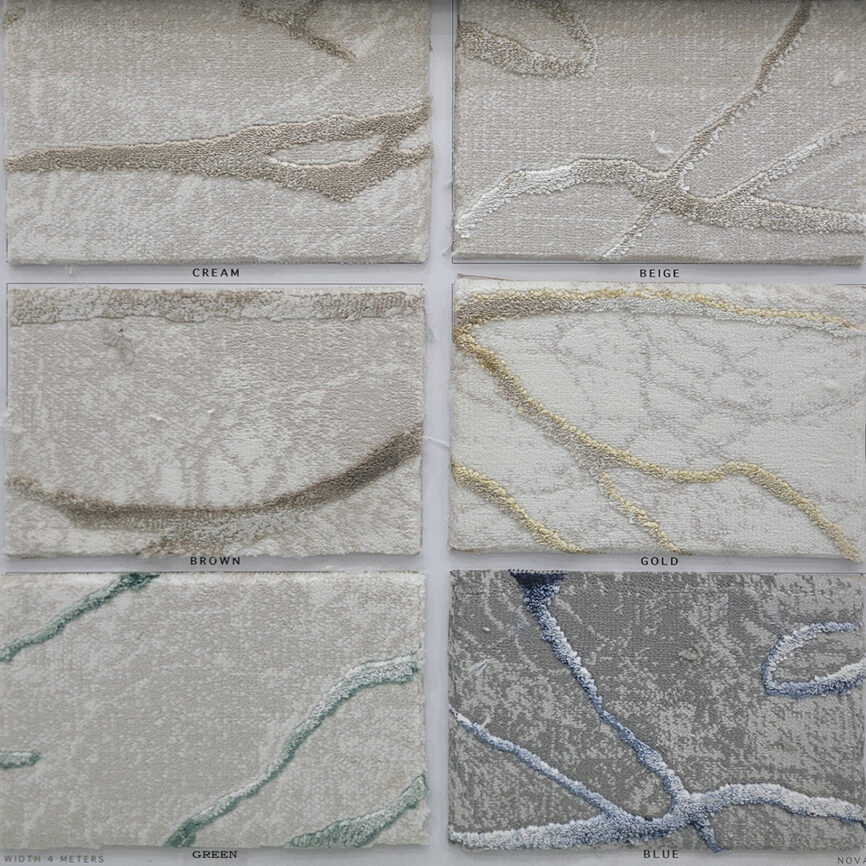 The Elegance Carpet in a close-up view, featuring a luxurious gray surface with gold vein-like patterns. Designed for wall-to-wall installations and customizable sizing.