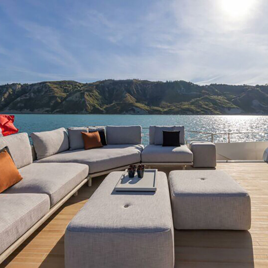 Custom modular outdoor yacht sofa with stainless steel frame and marine fabric, designed for saltwater conditions and tailored onboard comfort.