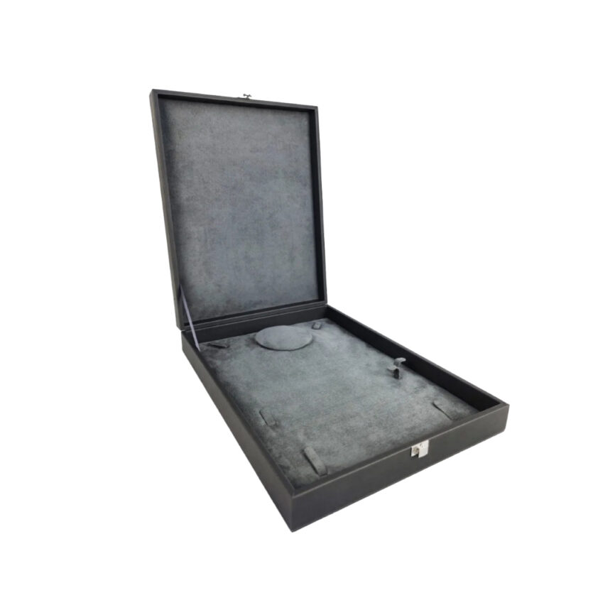 Open black box with gray velvet interior.