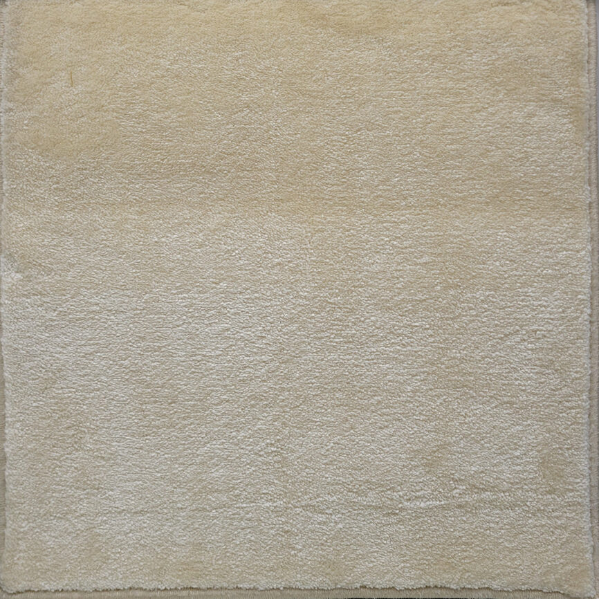 A collection of nine premium plain-colored carpet samples, showcasing versatile hues designed for modern interiors, available in wall-to-wall installation and custom sizing.