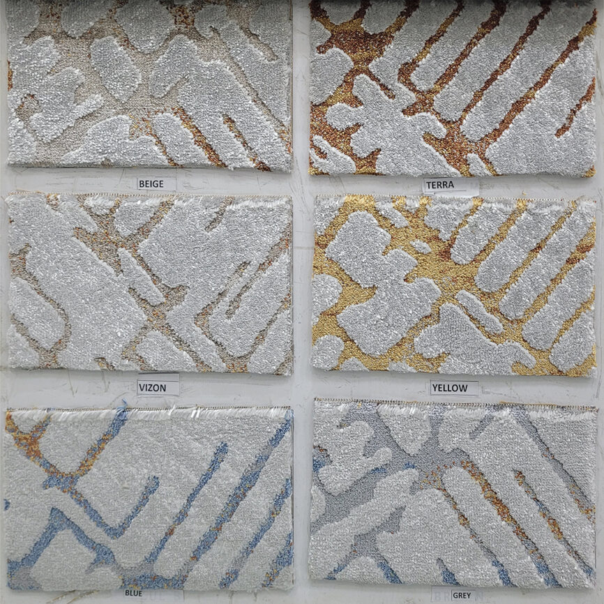 A close-up of Sandy Crest Carpet, featuring soft, flowing textures inspired by natural sand dunes, available in six elegant color variations.