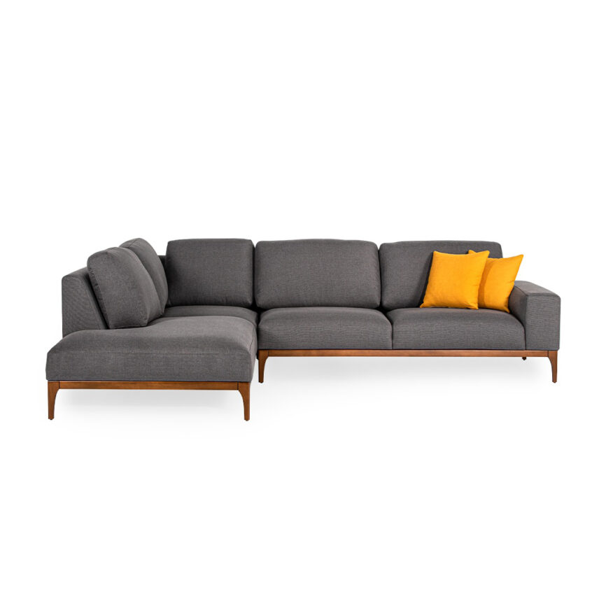 Ardena Corner Sofa styled with throw pillows, side table, and rug in a cozy setting.