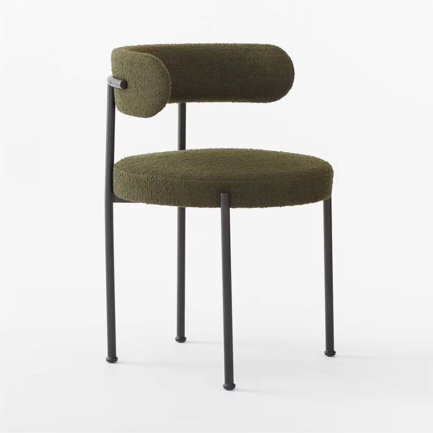 Inesse dining chair with ivory boucle upholstery and matte black steel frame, handcrafted by MZ FURNITURE in UAE.
