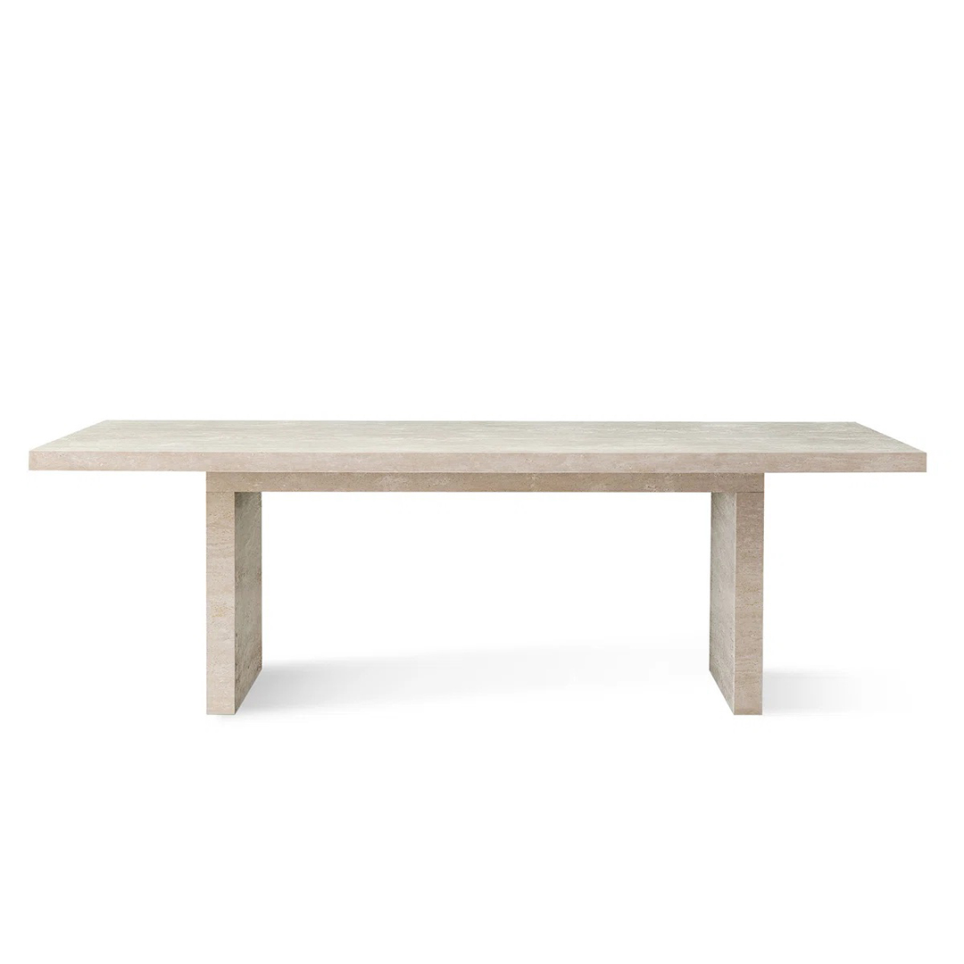 Rectangular travertine dining table with a natural stone top and sturdy base, seating up to 8 people.
