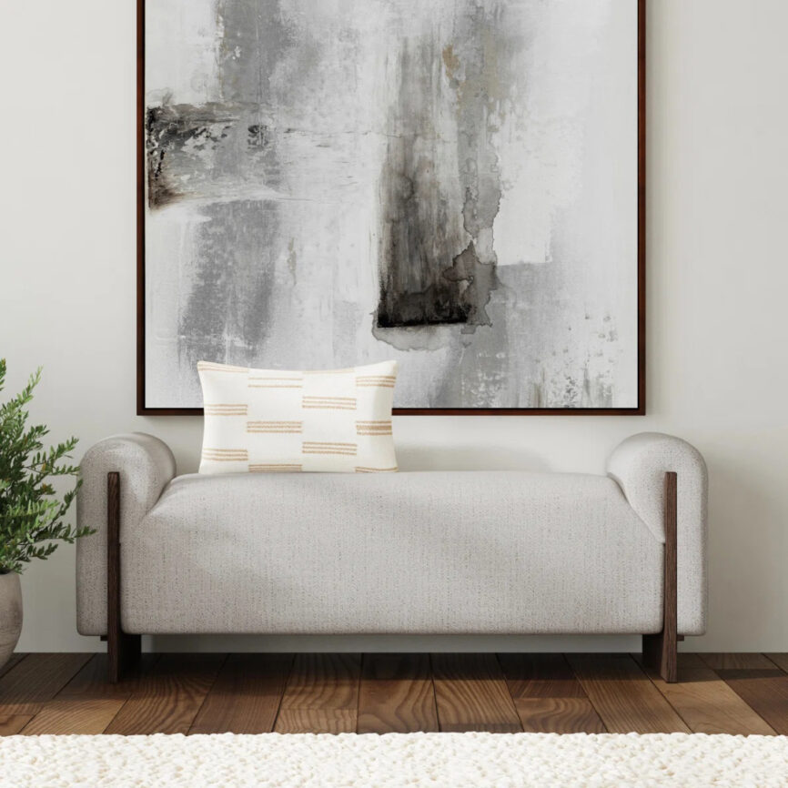 Beige chaise lounge styled with indoor plants in bright interior